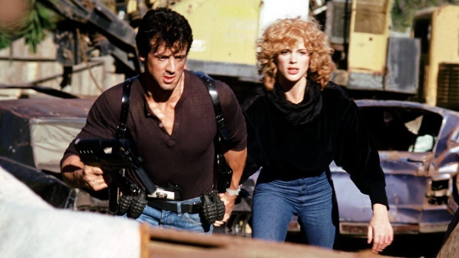 Sylvester Stallone met Brigitte Nielsen in Cobra Sylvester Stallone met Brigitte Nielsen in Cobra