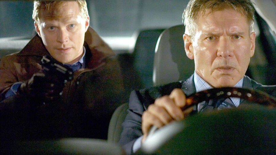 Paul Bettany en Harrison Ford in Firewall