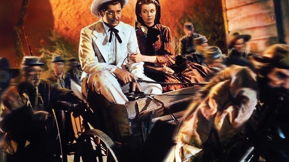 Clark Gable als Rhett Butler en Vivien Leigh als Scarlett in Gone with the Wild Clark Gable als Rhett Butler en Vivien Leigh als Scarlett in Gone with the Wild