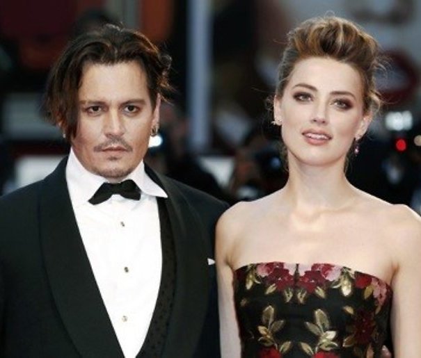 Hondensmokkelaar Amber Heard ontloopt gevangenisstraf