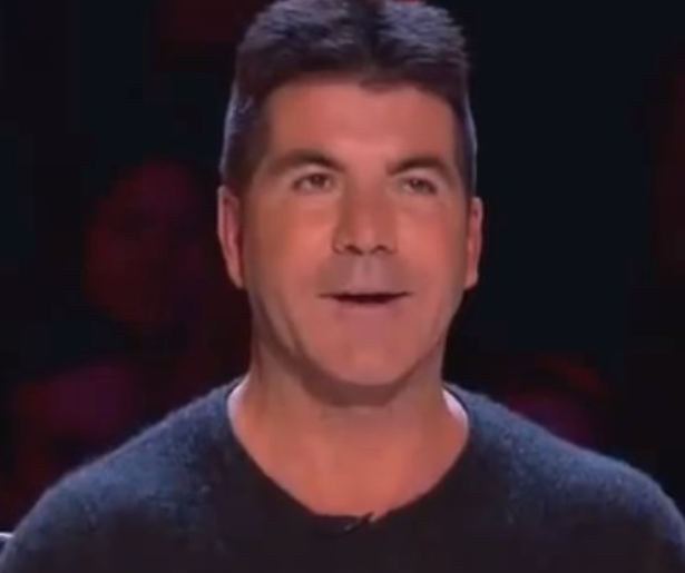 Cheryl Cole bedreigt Simon Cowell