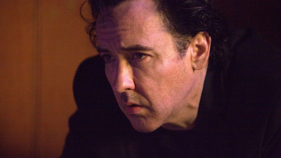 John Cusack in The Bag Man